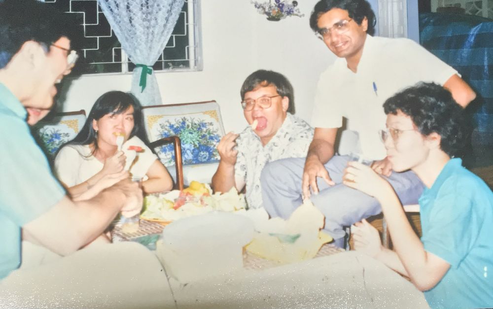 Ian enjoying food with friends at home