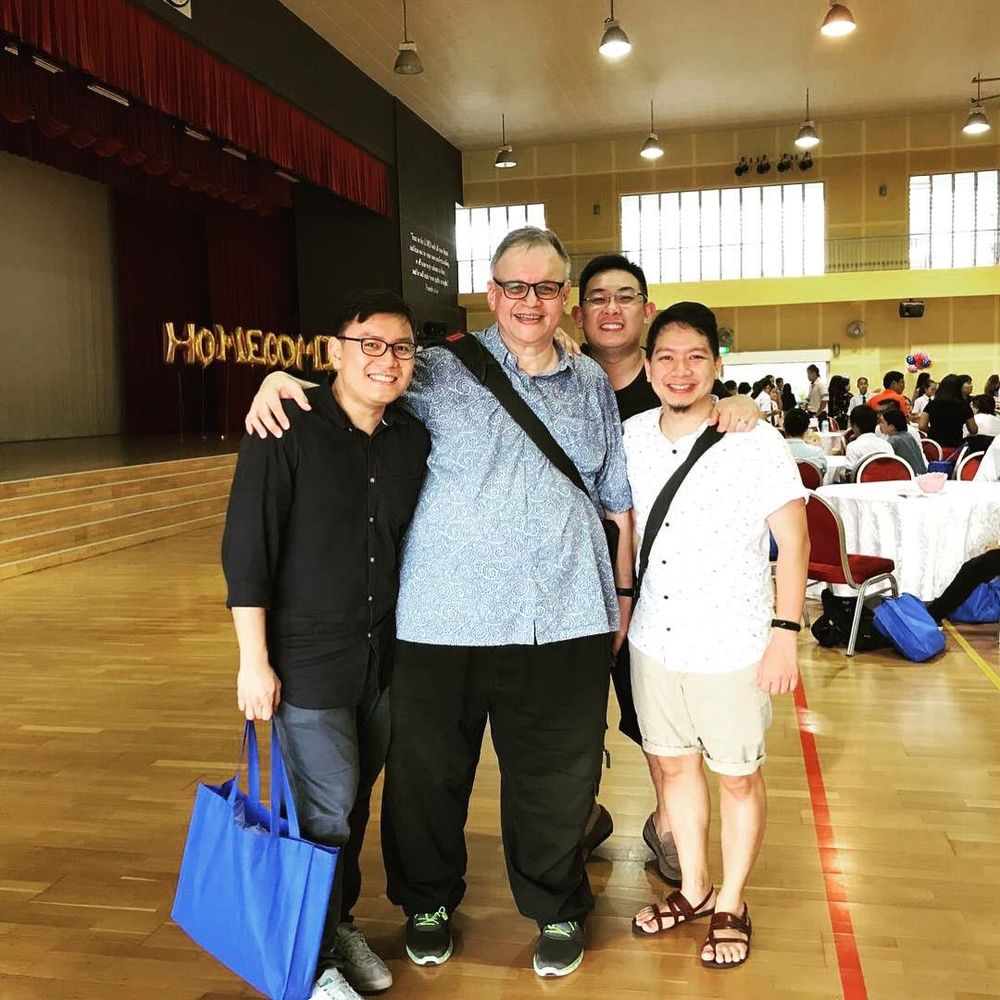 Ian with former students at a school homecoming