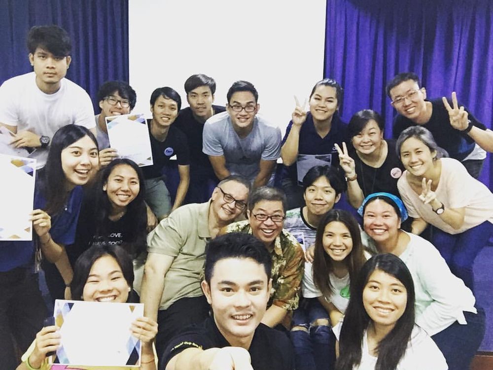 Ian with participants after a training workshop